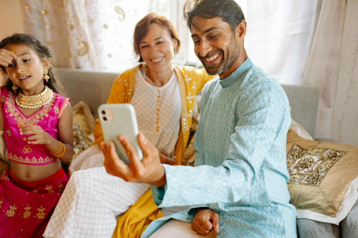 Family sharing photos on phone as apps for families to stay in touch