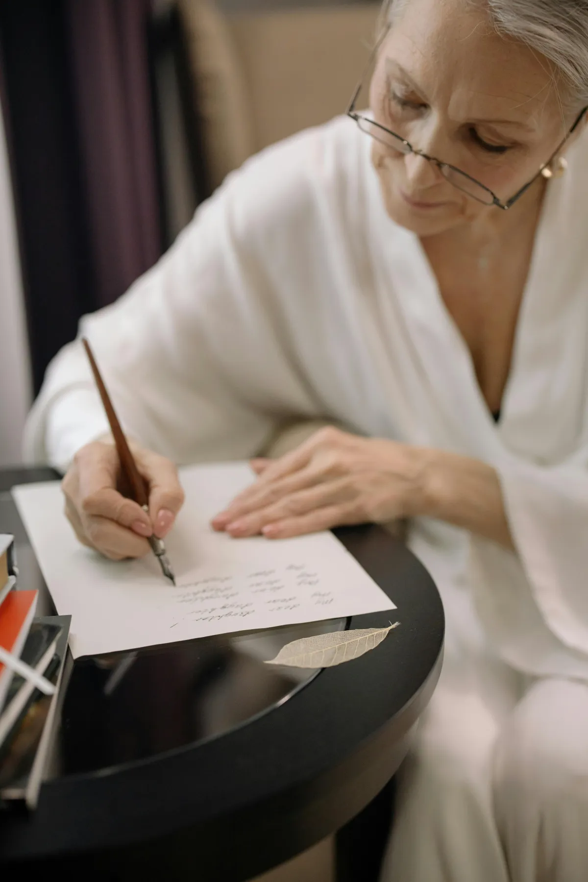 Grandparent writing letter to grandchild as long distance grandparenting activity