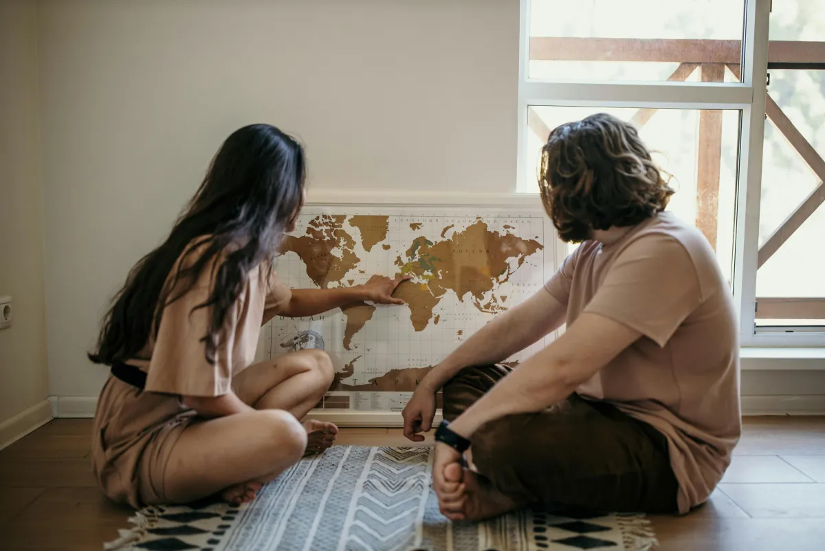 Couple looking at a map together, planning a trip
