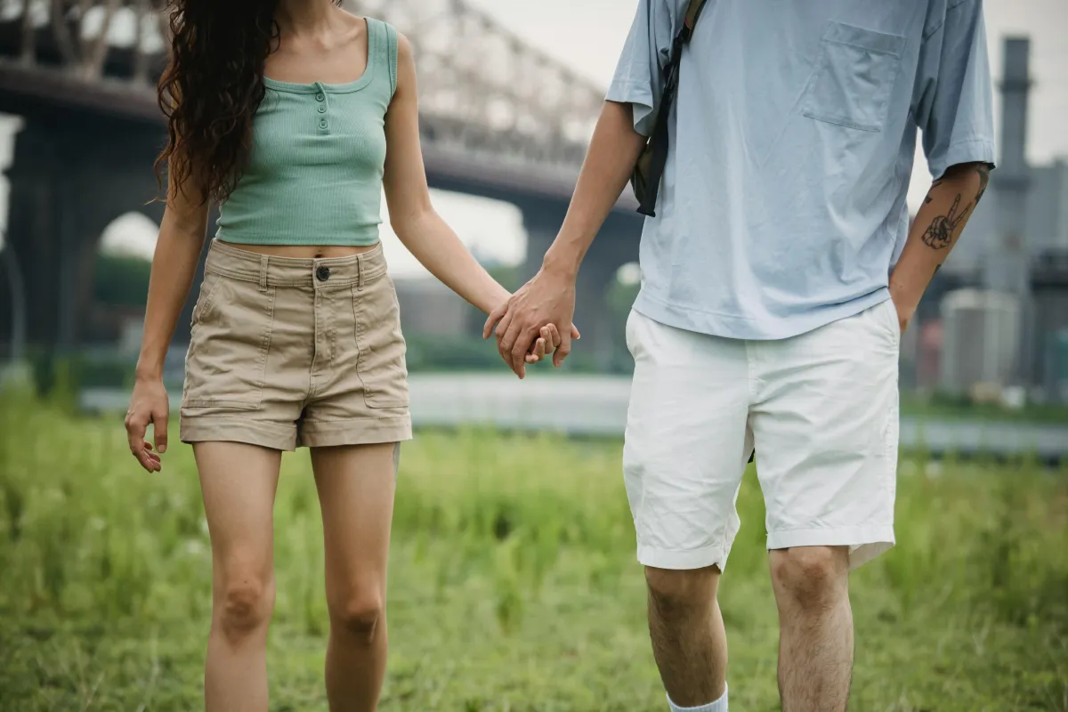Couple walking together holding hands in nature, micro moments relationship