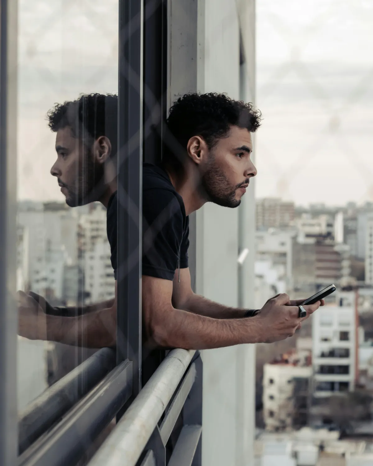 Couple looking at phones in different rooms, representing emotional distance in long distance relationships