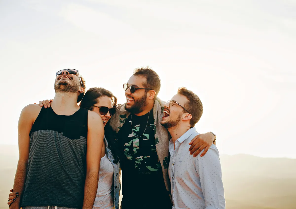 Friends sharing a genuine laugh together, intentional sharing moment